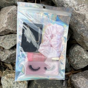 Pink pack with lipgloss bracelet lashes scrunchie